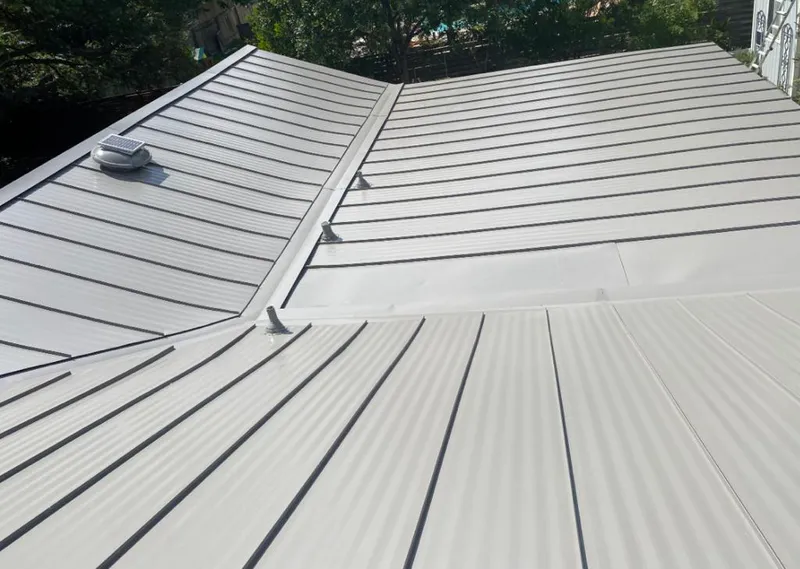 Solar attic fan installed on a metal roof for Roof Ventilation in Orland